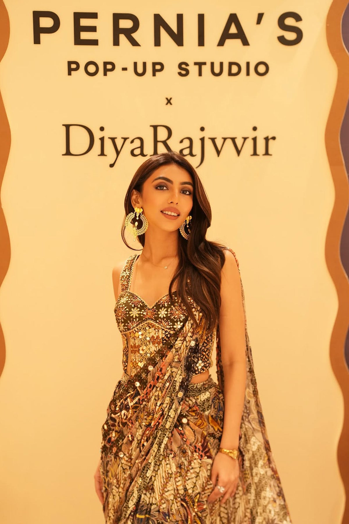 MALLAIKA CHHEDA IN OLIVE PRINT CORSET WITH DRAPE TIERED SKIRT SAREE SET