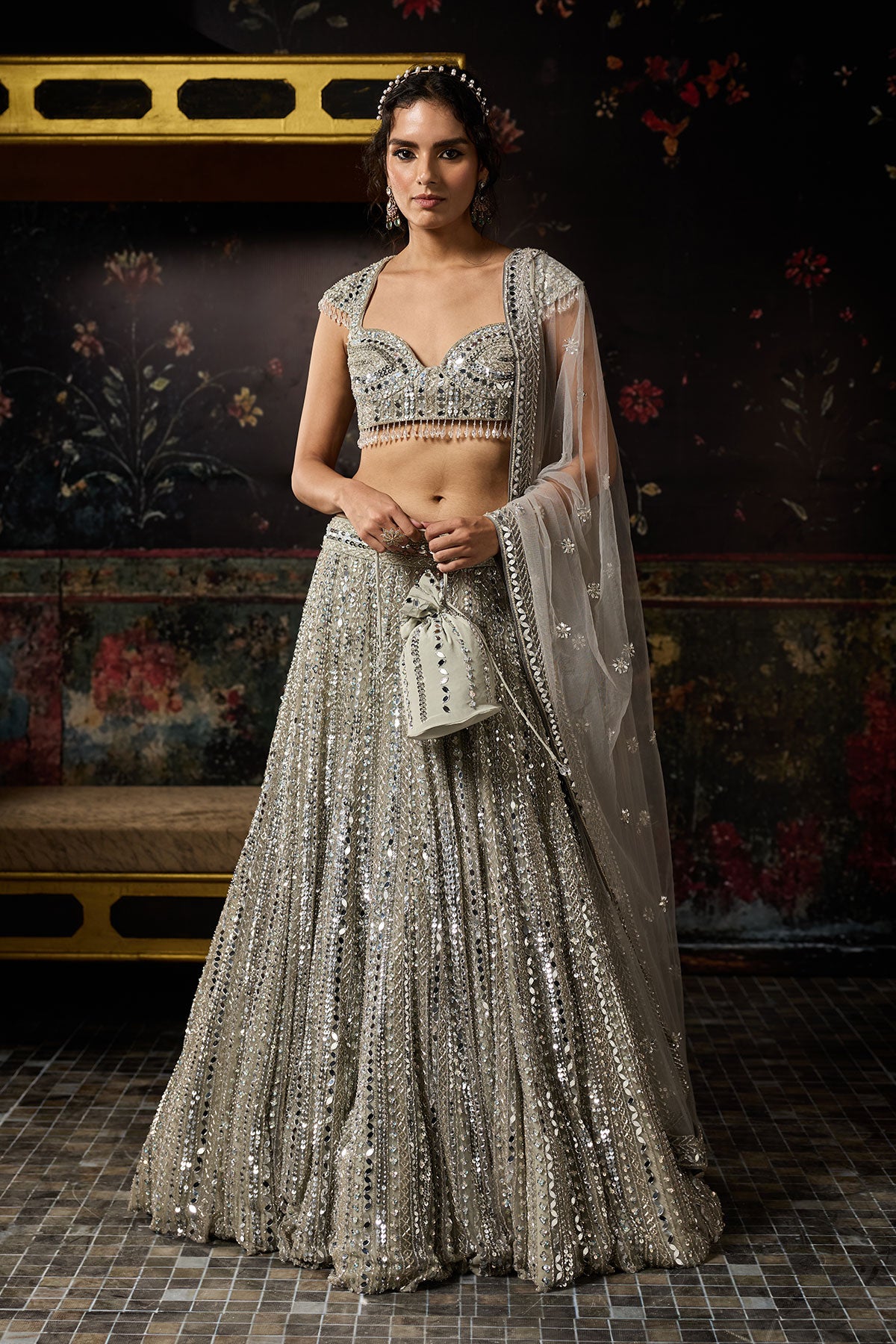 Komal Kapoor in Silver Embellished Mirrorwork Lehenga Set