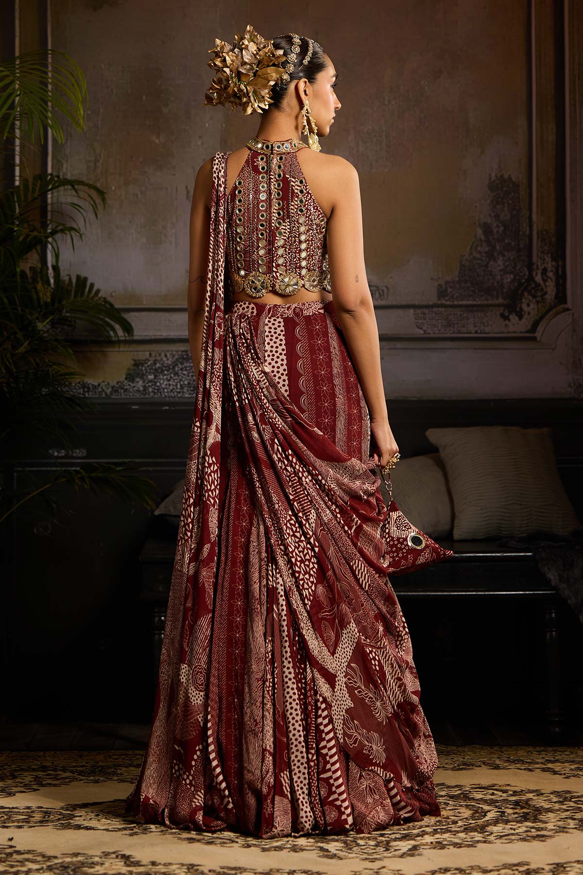 Nora Fatehi in Maroon Print and Highlighted Mermaid Saree Set