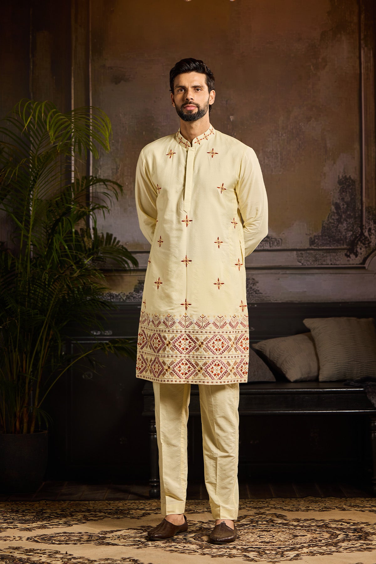 PASTEL YELLOW TRIBLE EMBROIDERED KURTA PAIRED WITH PASTEL YELLOW PANTS
