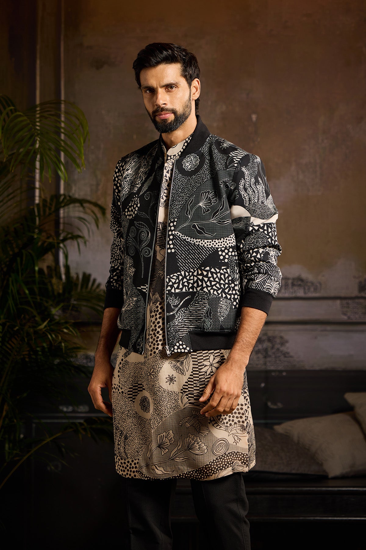 BLACK PRINTED BOMBER JACKET WITH BEIGE & BLACK PRINTED KURTA PAIRED WITH BLACK PANTS