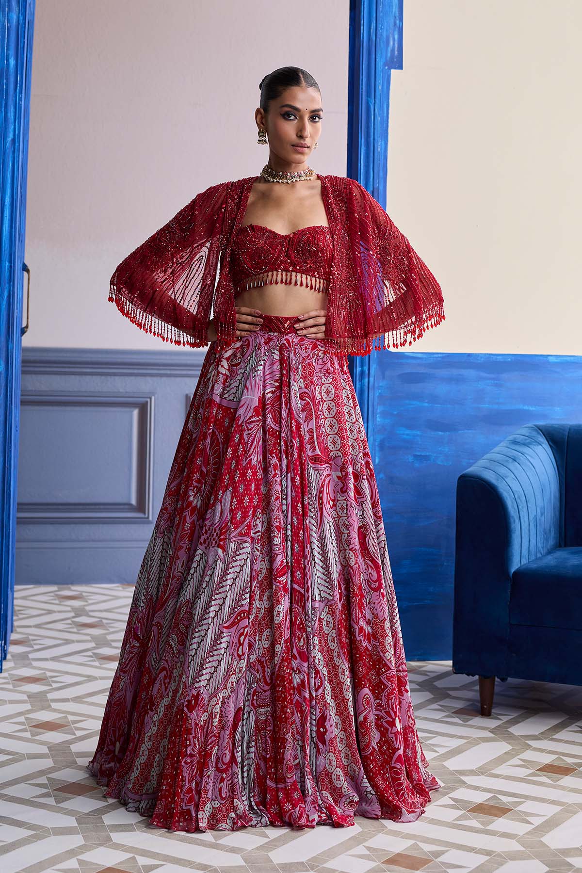 RED EMBROIDERED BLOUSE WITH TASSEL CAPE JACKET & FLORAL LEHENGA SET