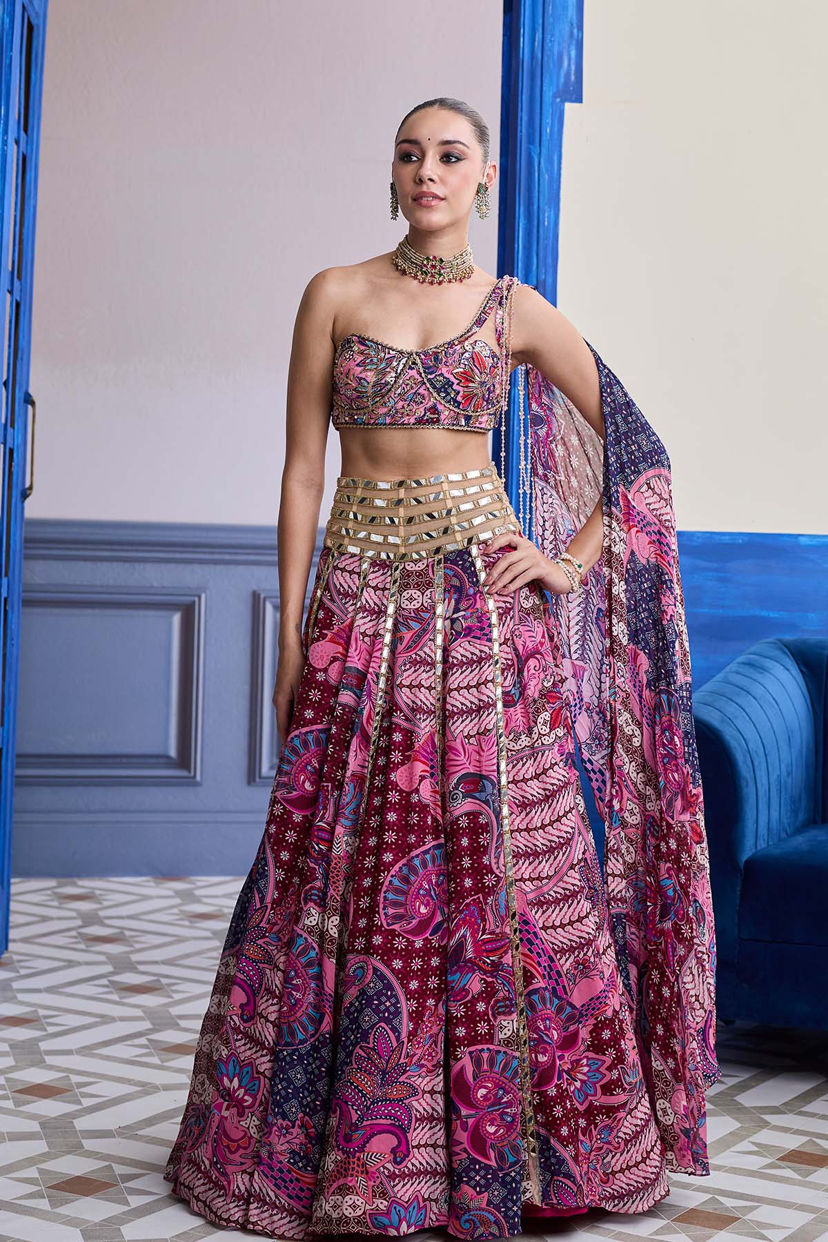FUCHSIA FLORAL ONE-SHOULDER DRAPE BLOUSE WITH MIRROR LEHENGA SET