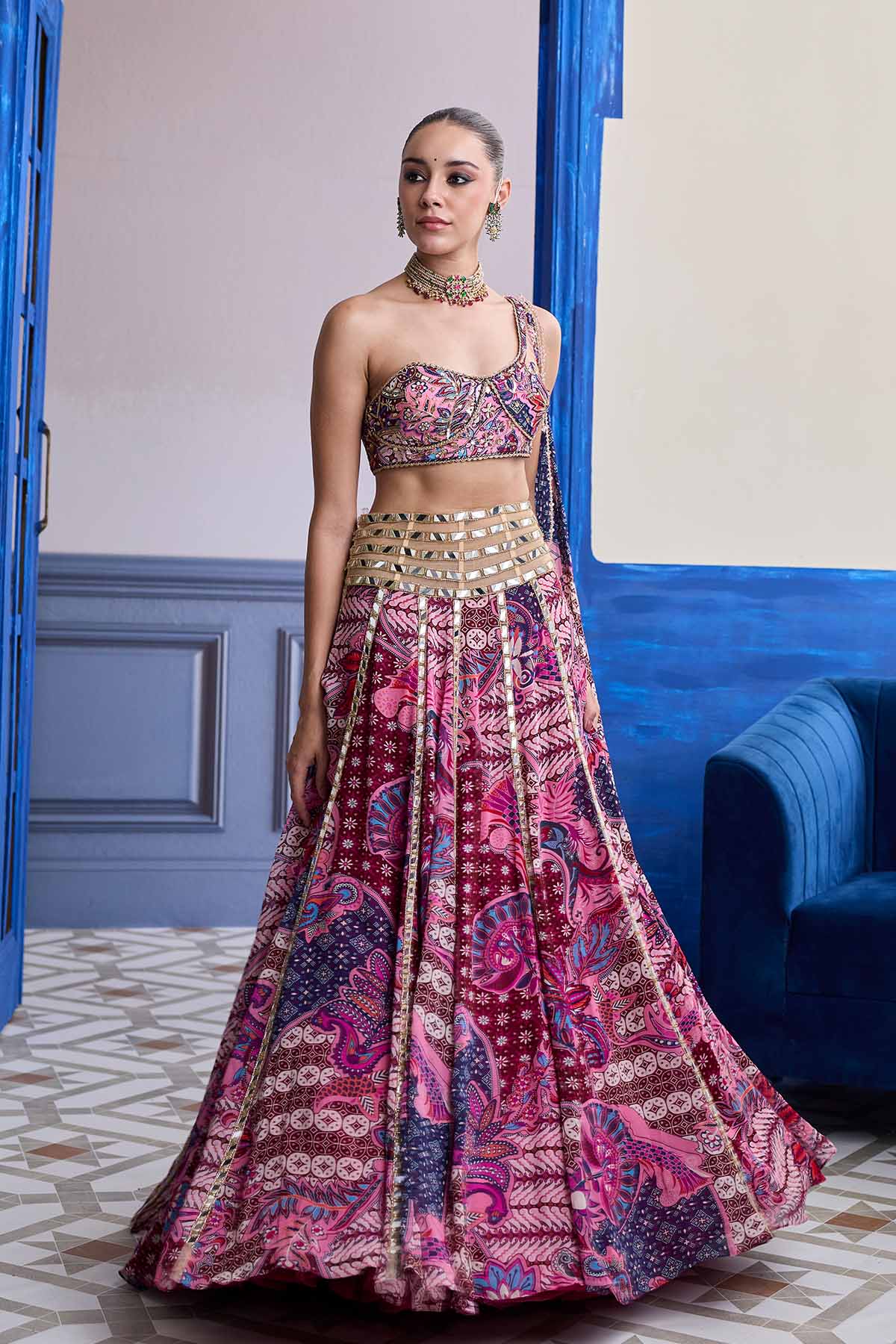 FUCHSIA FLORAL ONE-SHOULDER DRAPE BLOUSE WITH MIRROR LEHENGA SET