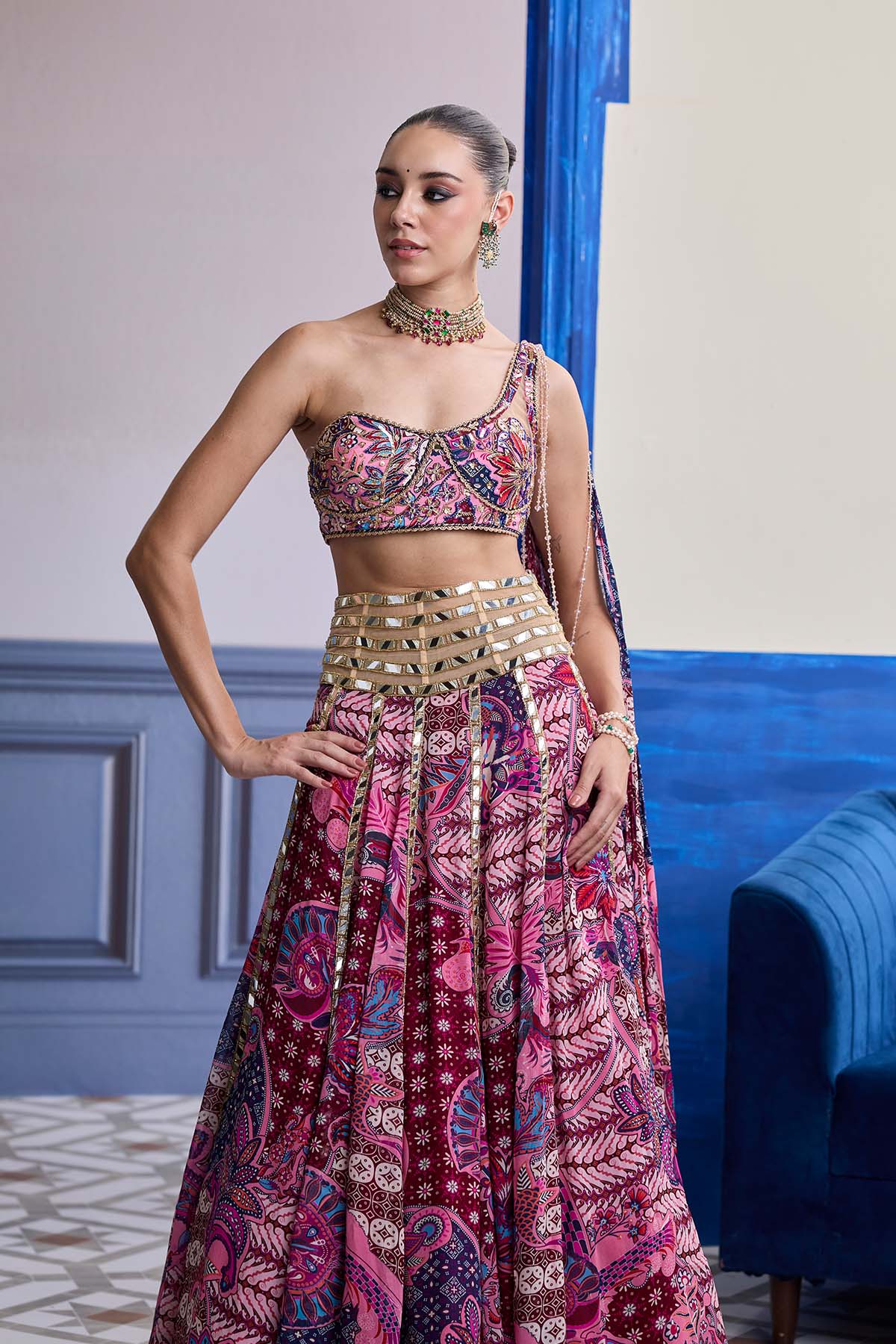 FUCHSIA FLORAL ONE-SHOULDER DRAPE BLOUSE WITH MIRROR LEHENGA SET