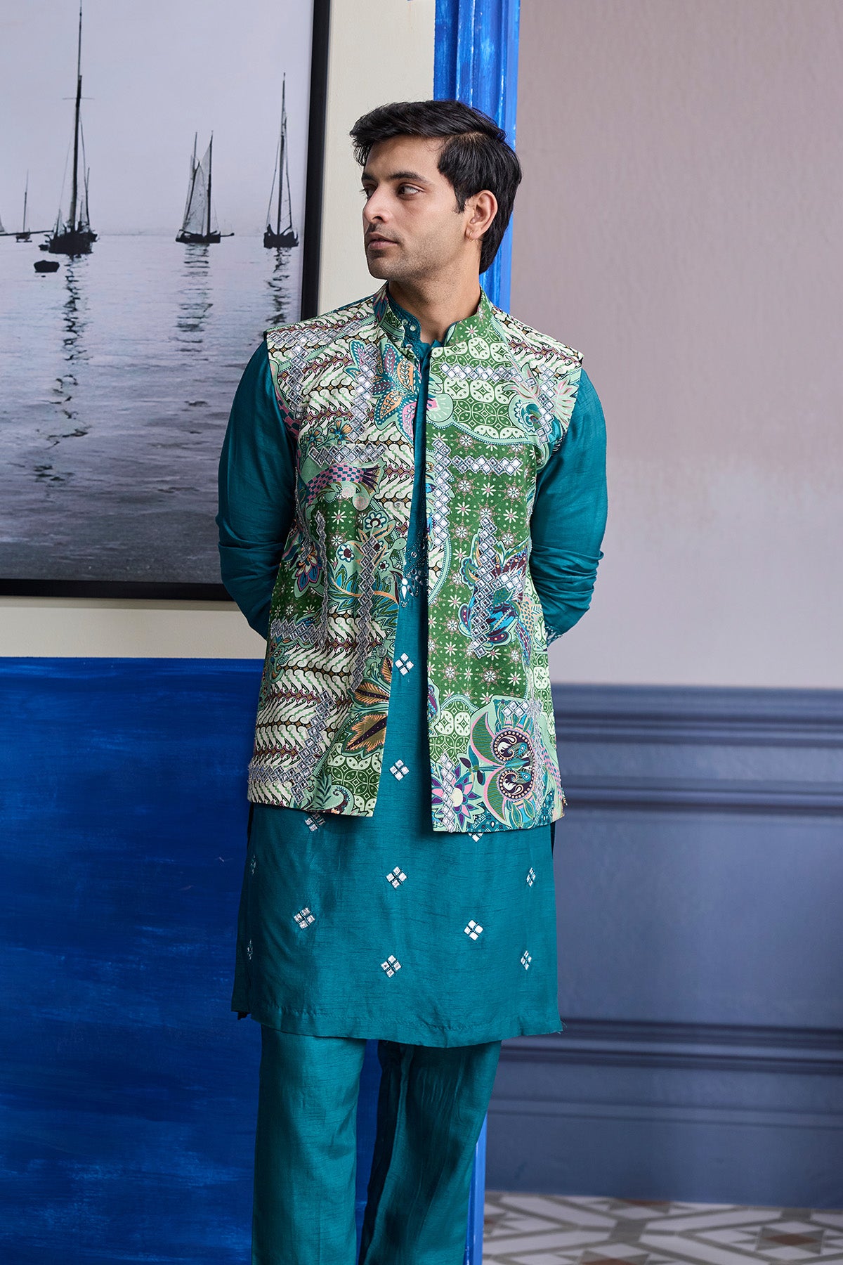 TEAL GREEN EMBROIDERED KURTA WITH PRINT HIGHLIGHTED BUNDI JACKET PAIERD WITH SOLID PANTS