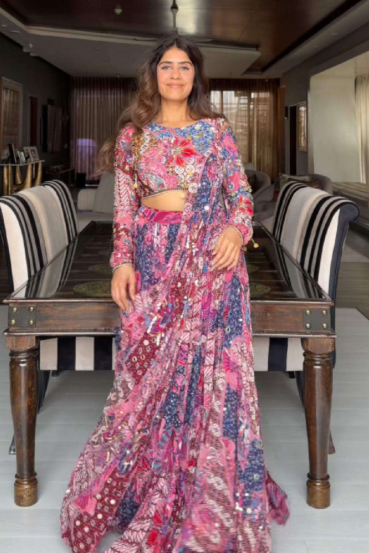 MEHEK KEJRIWAL IN FUCHSIA FLORAL BLOUSE WITH DRAPE TIERED SAREE SKIRT SET
