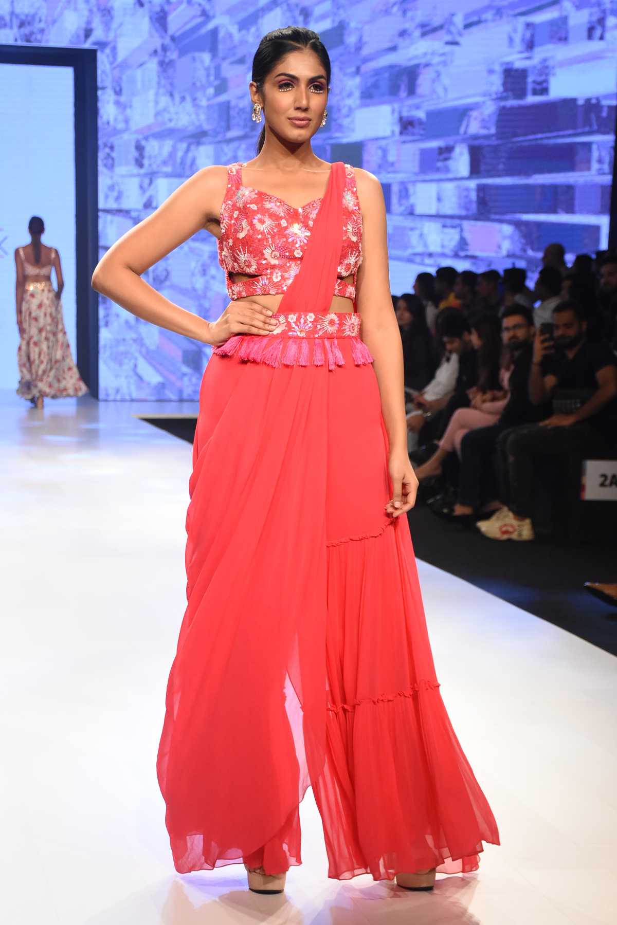 HOT PINK 3D SELF ON SELF EMBROIDERED CUT OUT BLOUSE WITH PRESTICHED TIERED PANTS SAREE & EMBROIDERED TASSEL BELT