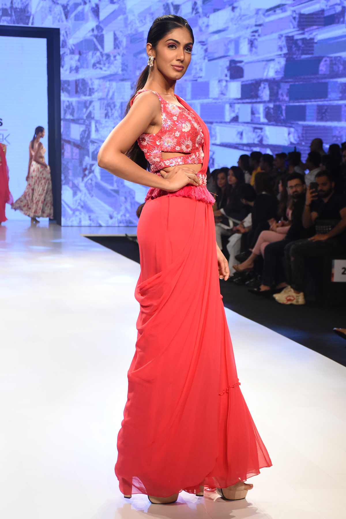 HOT PINK 3D SELF ON SELF EMBROIDERED CUT OUT BLOUSE WITH PRESTICHED TIERED PANTS SAREE & EMBROIDERED TASSEL BELT