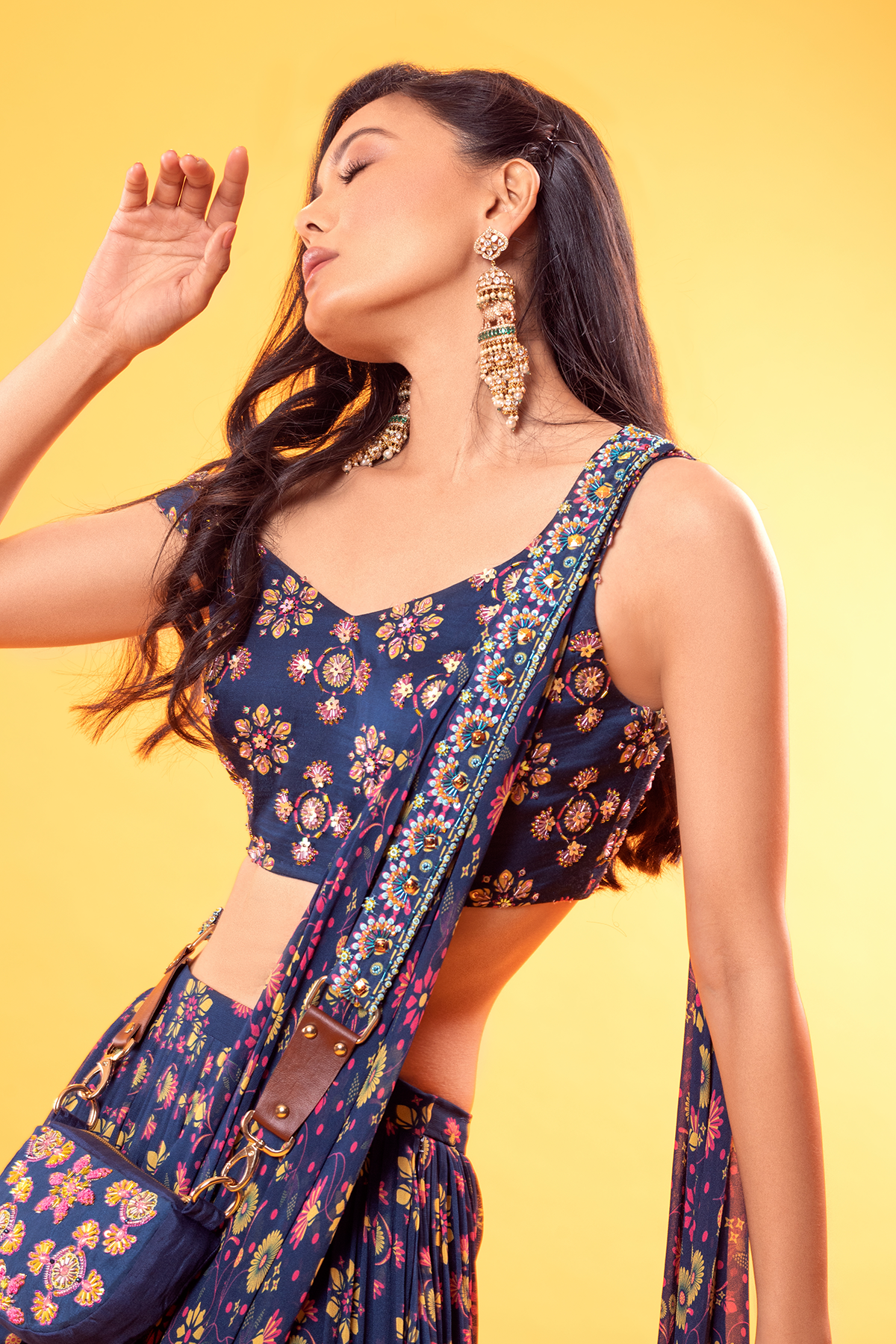 BLUE MIX BUTTA PRINTED V NECK BLOUSE WITH JAAL PRINTED TIERED SKIRT SAREE & POTLI BAG