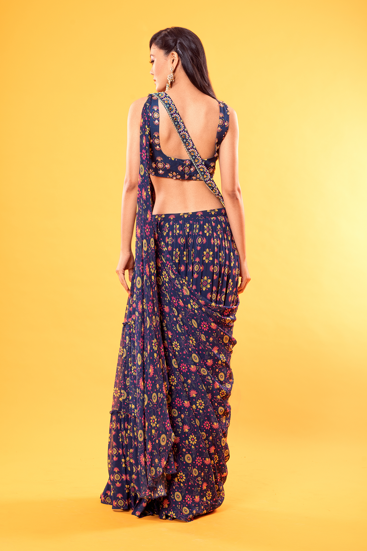 BLUE MIX BUTTA PRINTED V NECK BLOUSE WITH JAAL PRINTED TIERED SKIRT SAREE & POTLI BAG