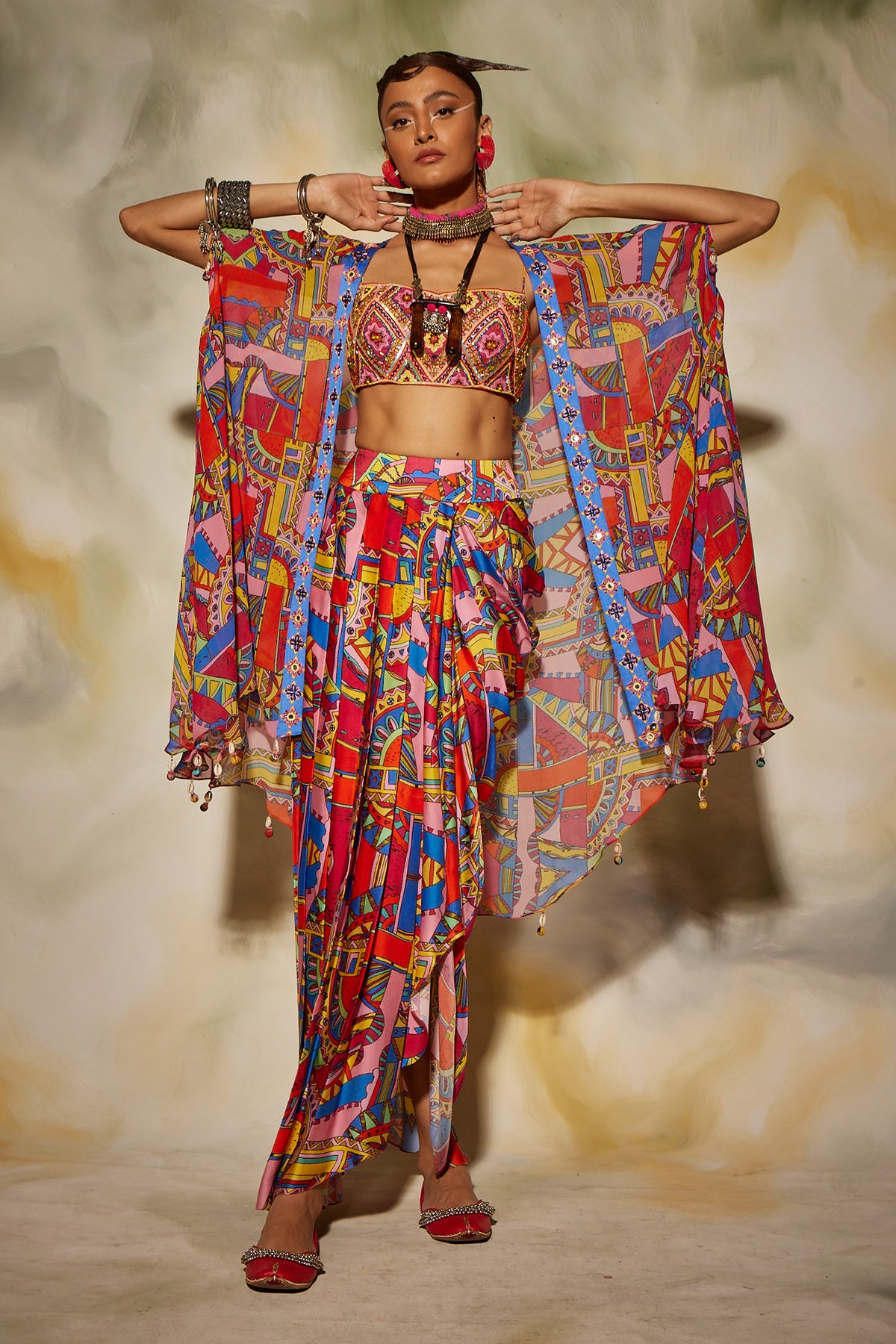 Pink & Blue geometric print front open cape detailed with tassels and dhoti skirt
