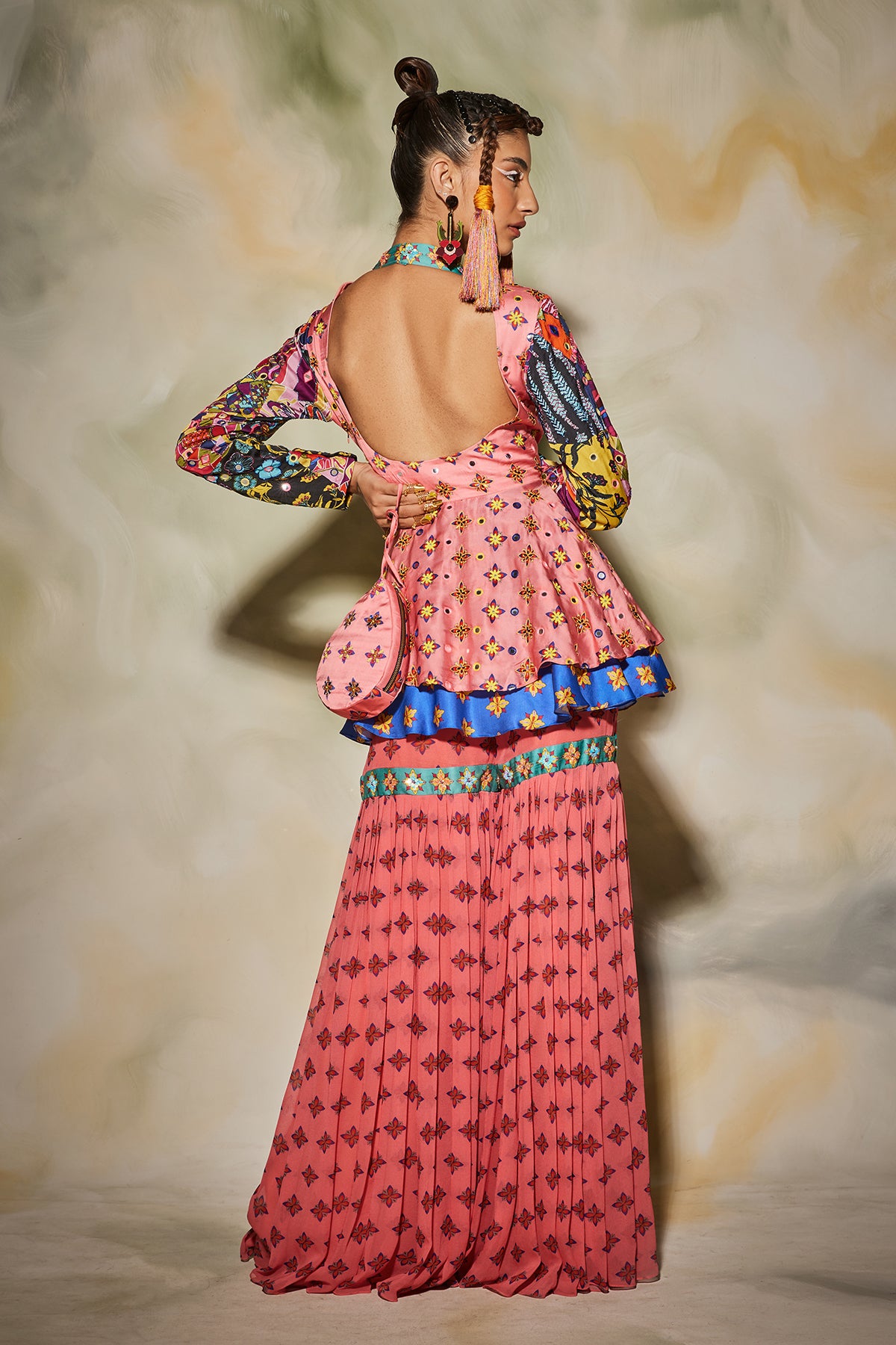 Pink butta gharara pants detailed with embroidered patti with layered peplum top & drop potali bag