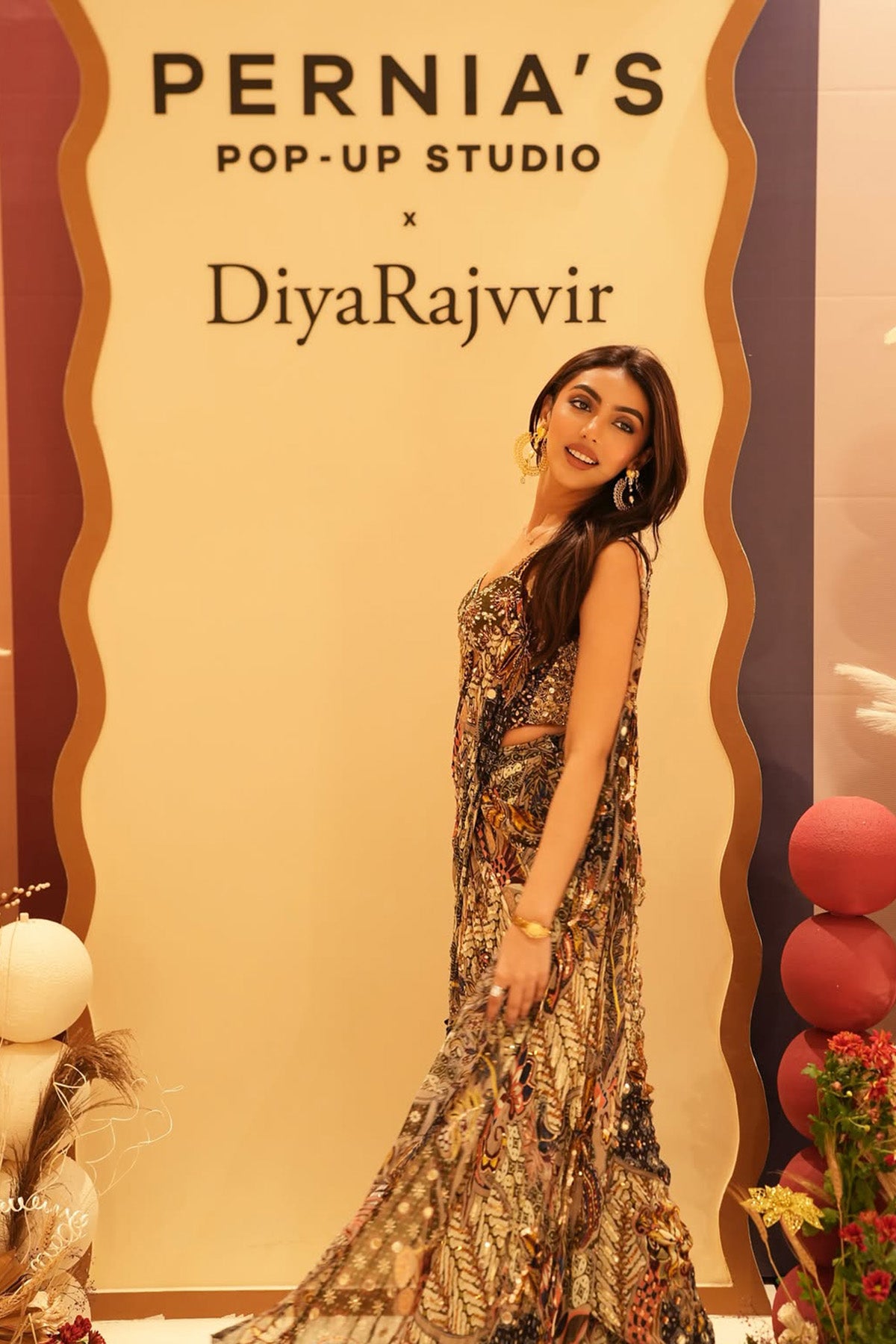 MALLAIKA CHHEDA IN OLIVE PRINT CORSET WITH DRAPE TIERED SKIRT SAREE SET