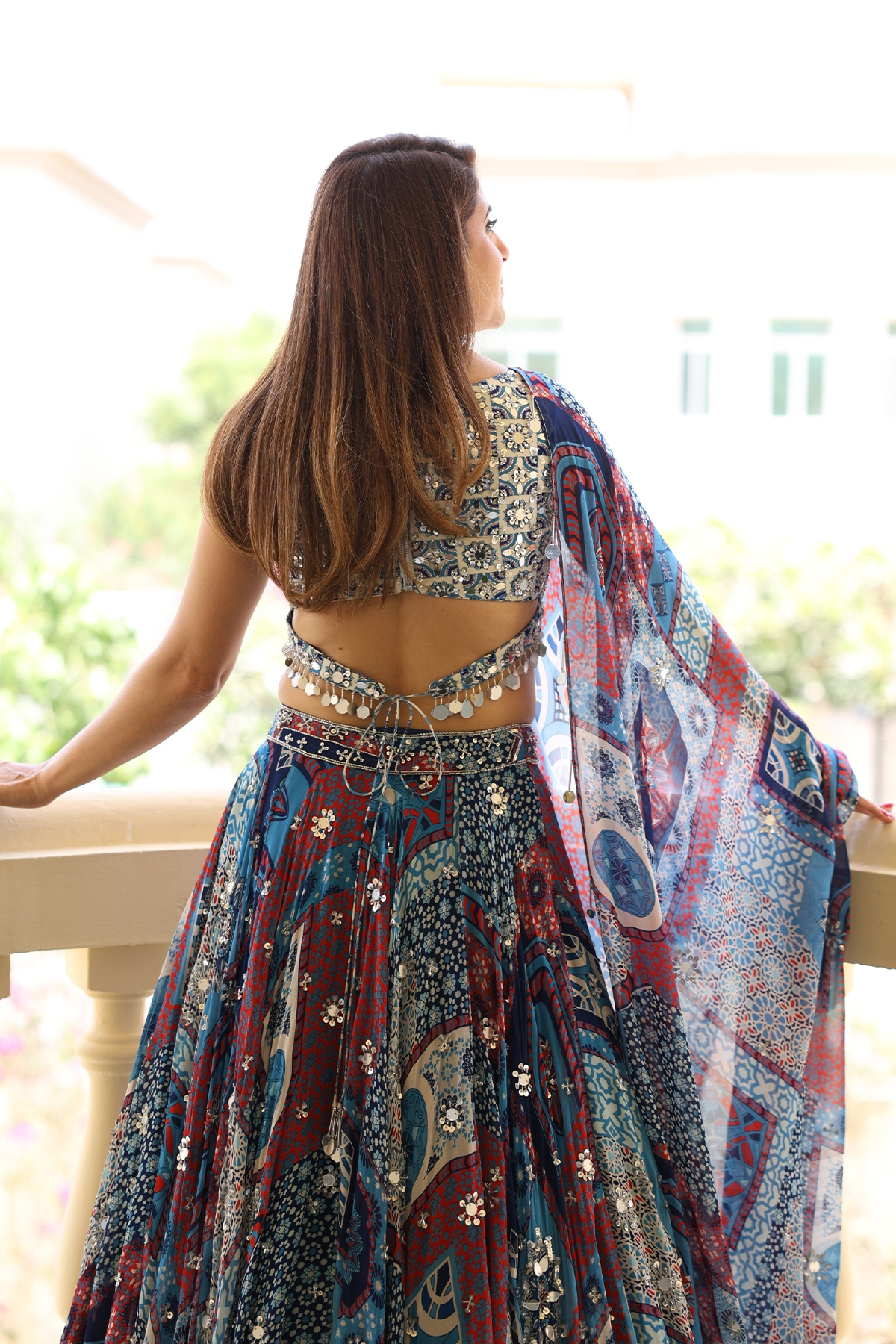 Anjali in Ivory Butta Print And Highlighted Blouse With Teal Print And Highlighted Lehenga Set