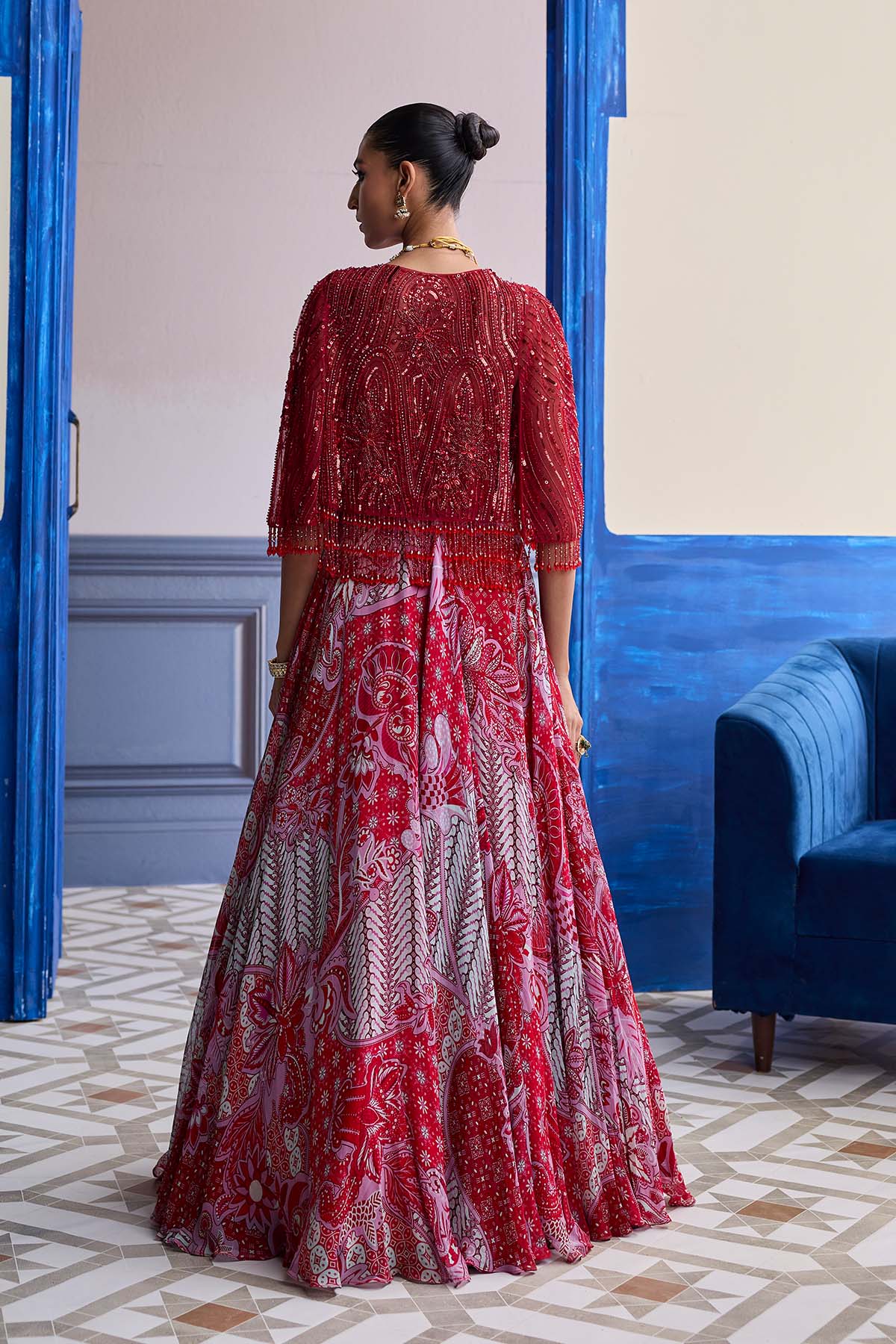 RED EMBROIDERED BLOUSE WITH TASSEL CAPE JACKET & FLORAL LEHENGA SET