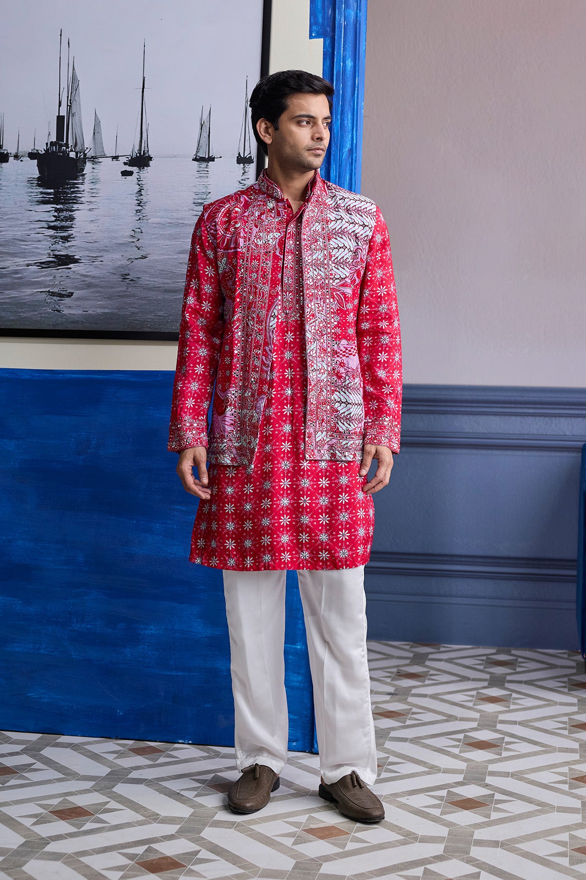RED PRINT HIGHLIGHTED  KURTA WITH PRINT EMBROIDERED BUNDI AND IVORY PANTS