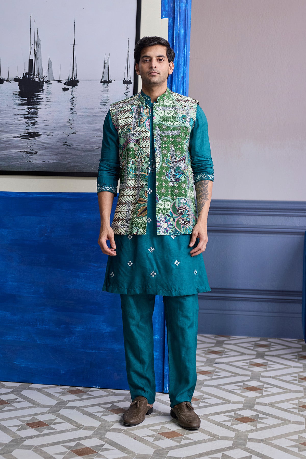 TEAL GREEN EMBROIDERED KURTA WITH PRINT HIGHLIGHTED BUNDI JACKET PAIERD WITH SOLID PANTS