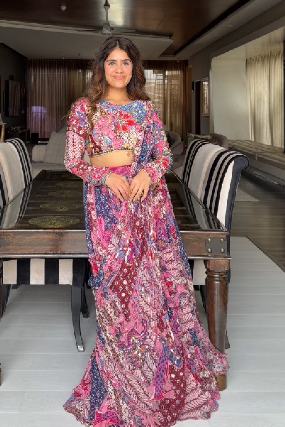 MEHEK KEJRIWAL IN FUCHSIA FLORAL BLOUSE WITH DRAPE TIERED SAREE SKIRT SET