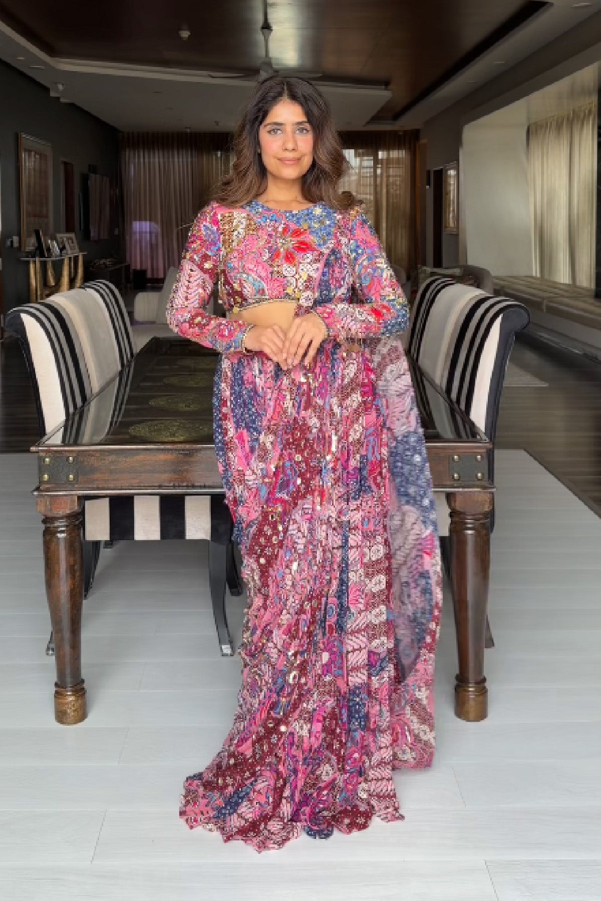 MEHEK KEJRIWAL IN FUCHSIA FLORAL BLOUSE WITH DRAPE TIERED SAREE SKIRT SET