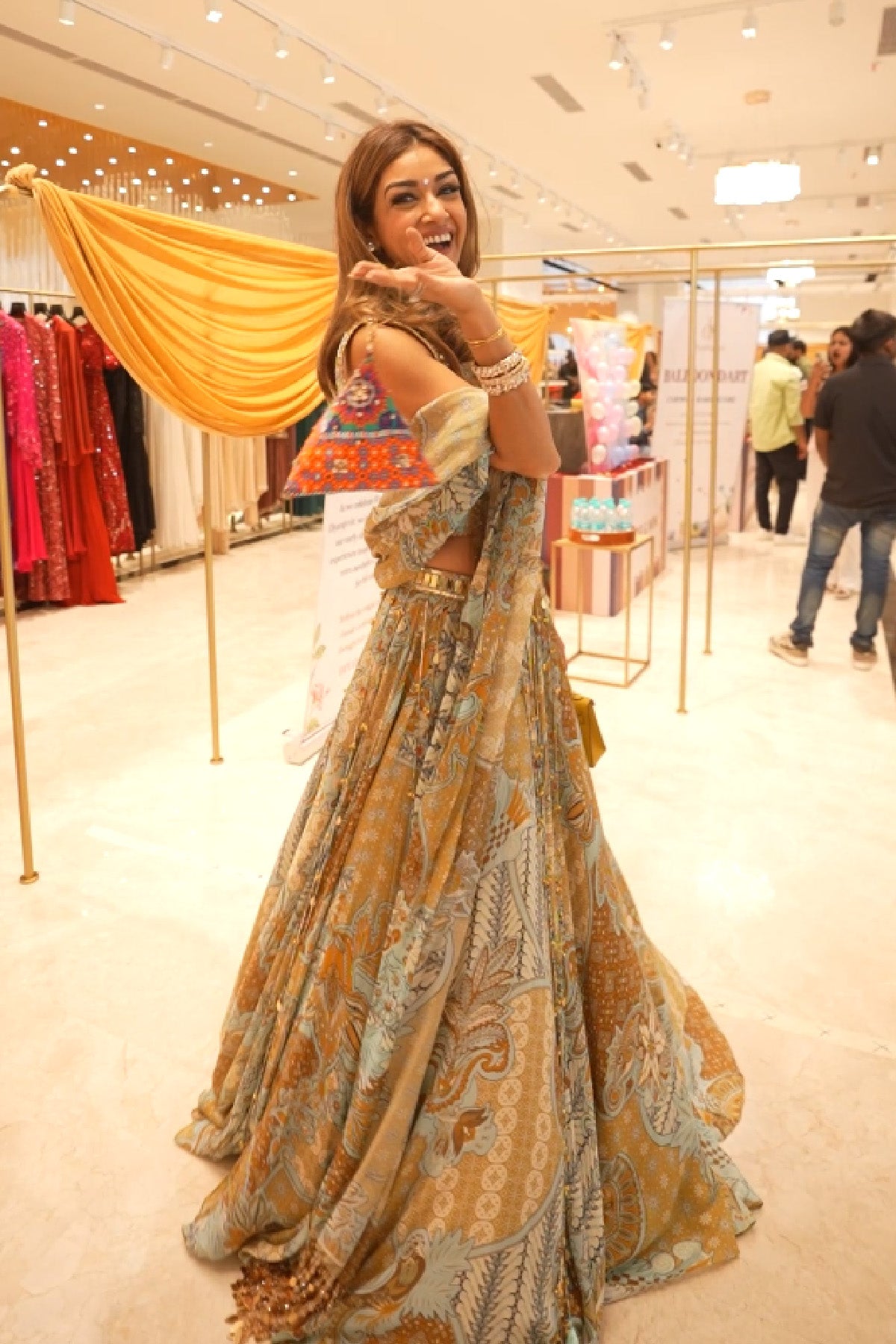 ISHA SAWHNEY IN YELLOW FLORAL CORSET WITH TASSEL LEHENGA & PRINTED DUPATTA SET
