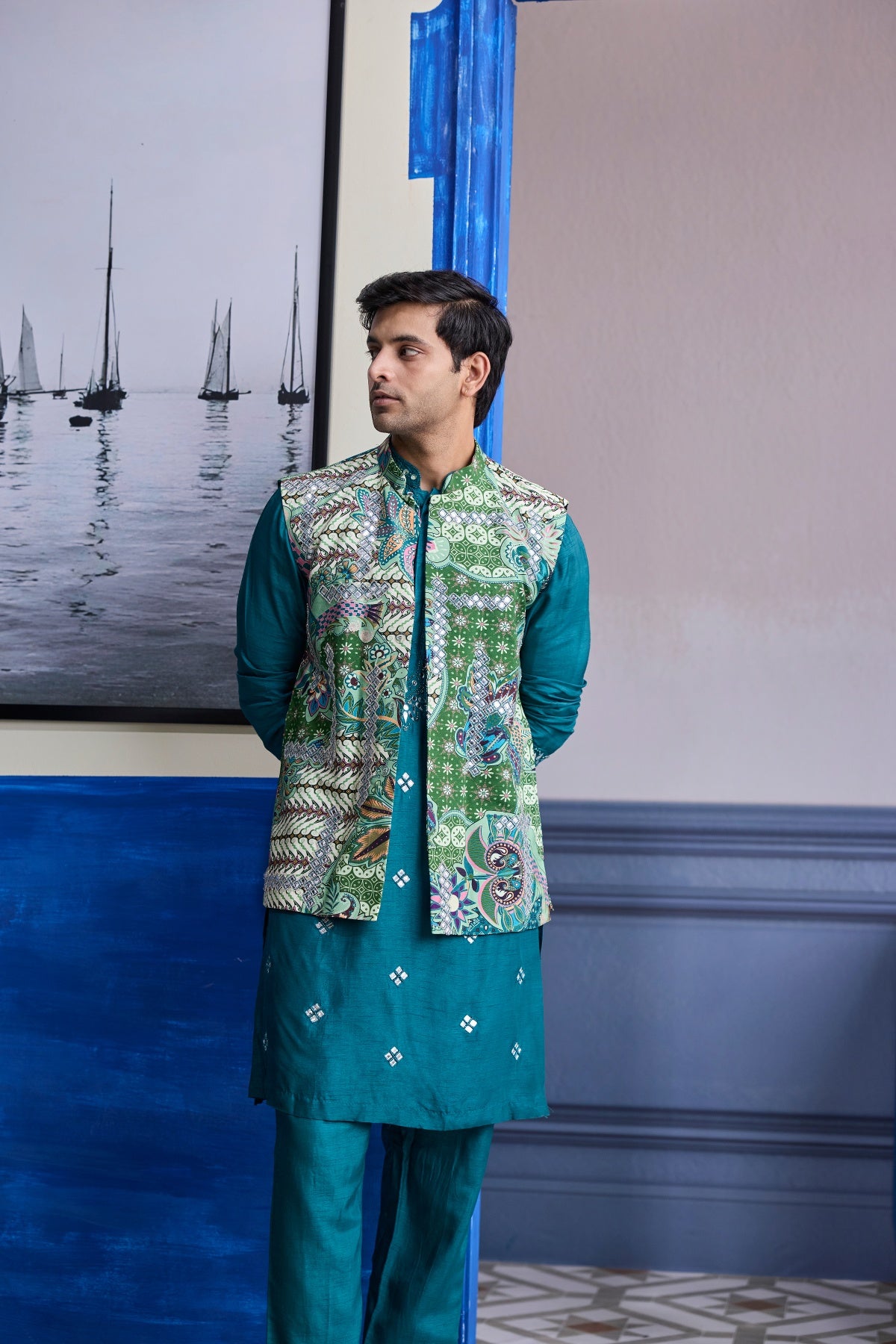 TEAL GREEN EMBROIDERED KURTA WITH PRINT HIGHLIGHTED BUNDI JACKET PAIERD WITH SOLID PANTS