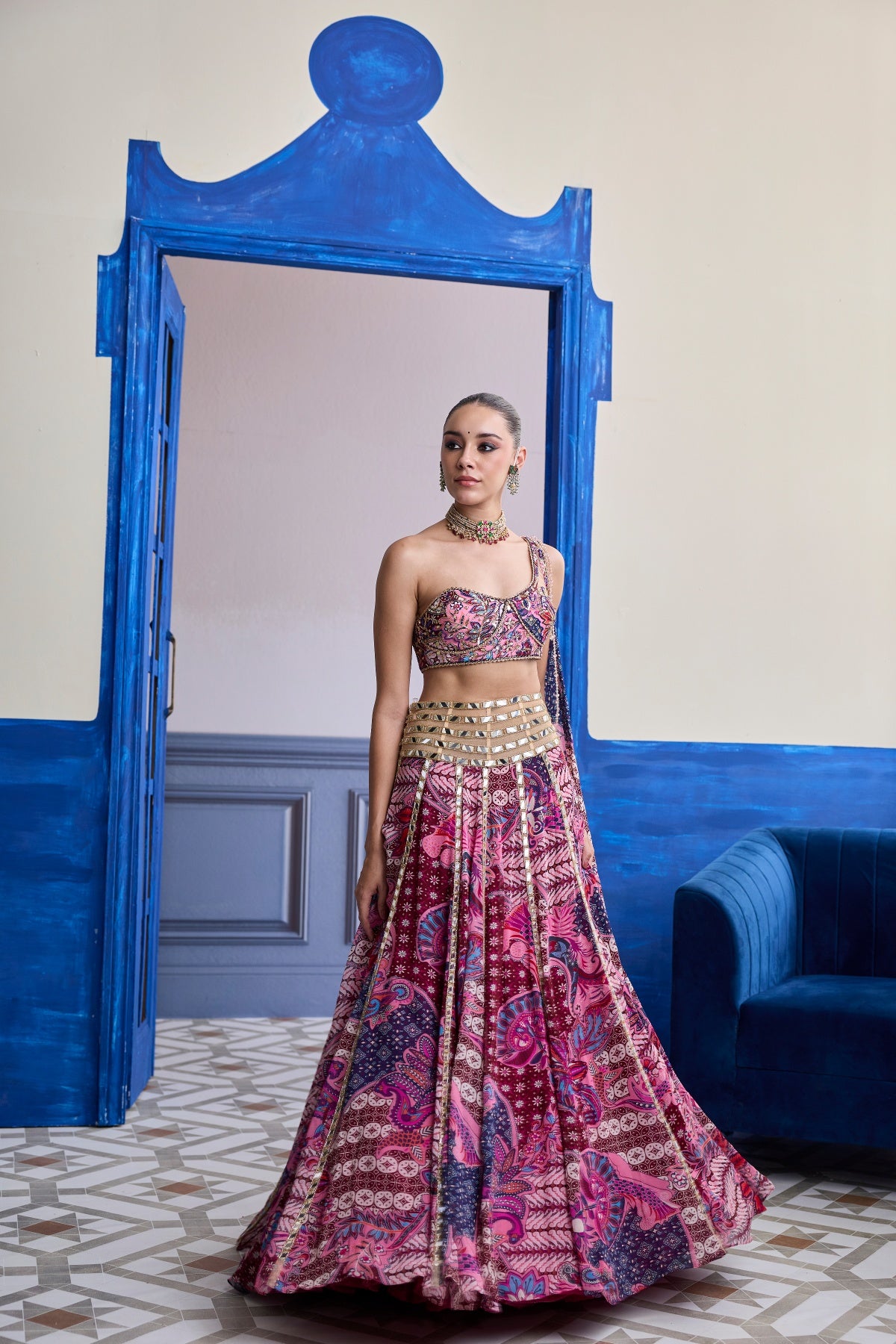 FUCHSIA FLORAL ONE-SHOULDER DRAPE BLOUSE WITH MIRROR LEHENGA SET