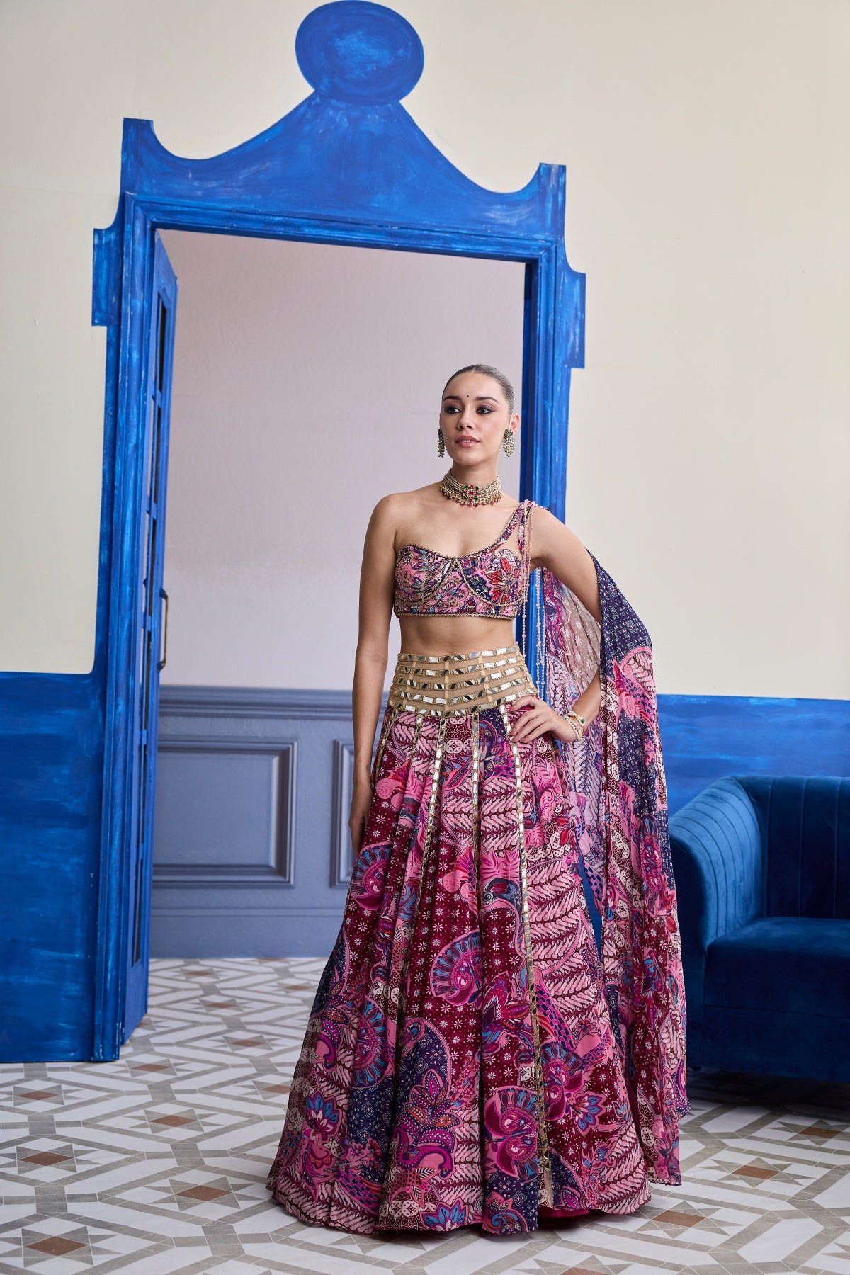 FUCHSIA FLORAL ONE-SHOULDER DRAPE BLOUSE WITH MIRROR LEHENGA SET