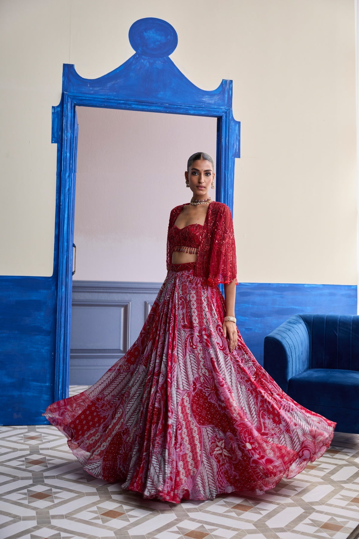 RED EMBROIDERED BLOUSE WITH TASSEL CAPE JACKET & FLORAL LEHENGA SET