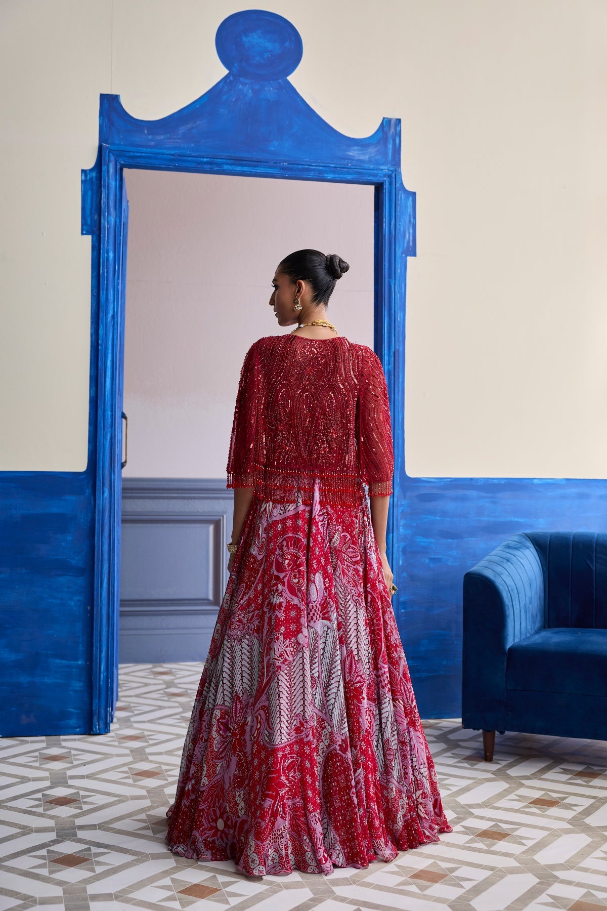 RED EMBROIDERED BLOUSE WITH TASSEL CAPE JACKET & FLORAL LEHENGA SET