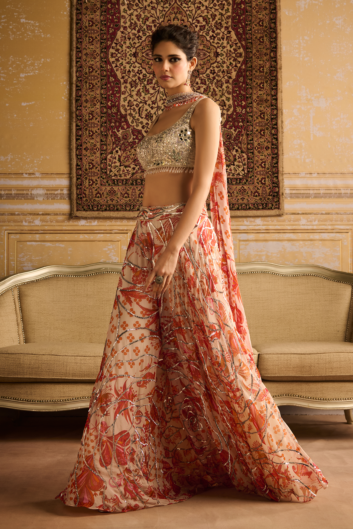 Silver embroidered blouse and Orange cosmic floral jaal Sharara set