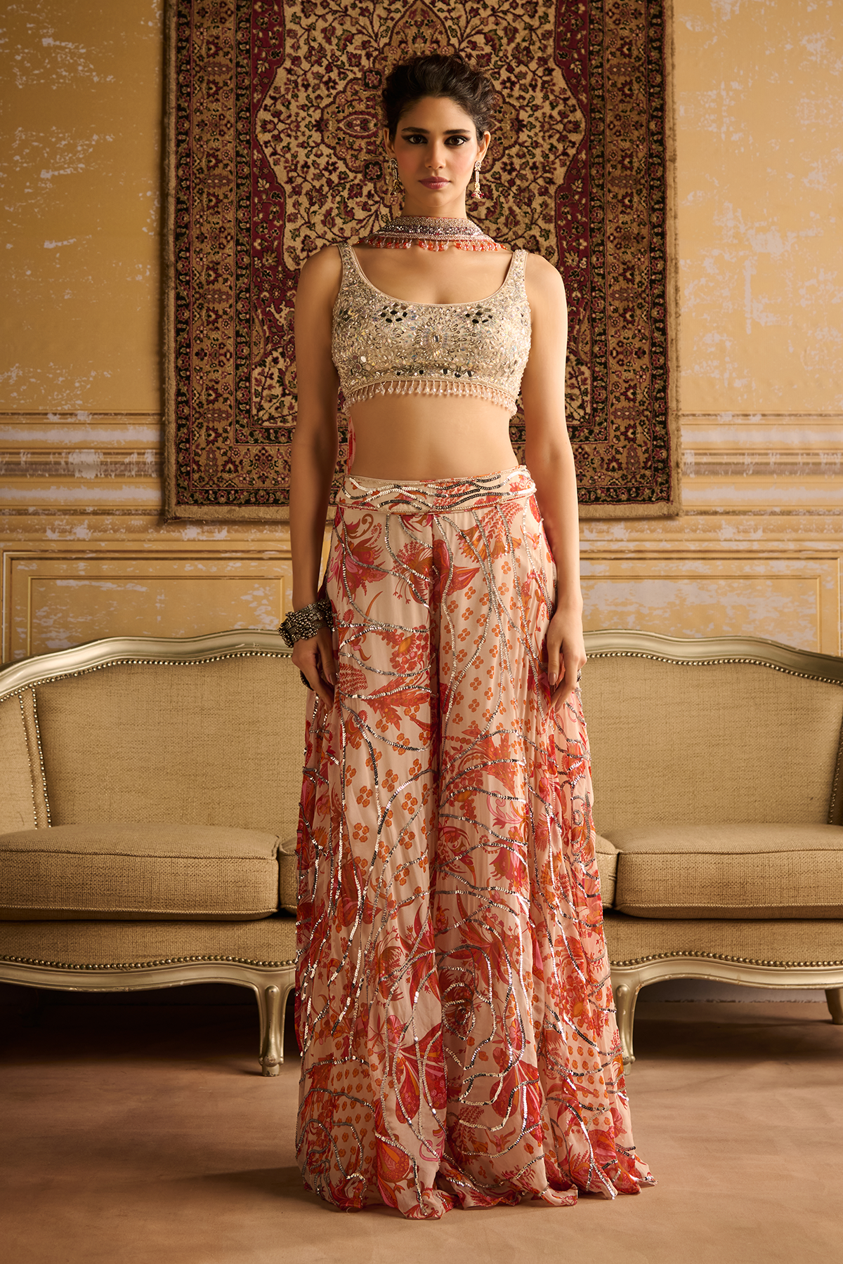 Silver embroidered blouse and Orange cosmic floral jaal Sharara set