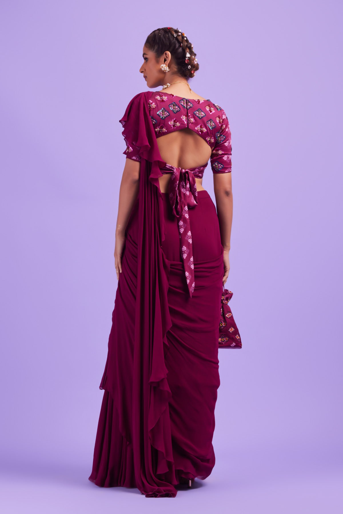 Purple Butta Highlighted Blouse with Purple Layer Ruffle Sari & Potli Bag